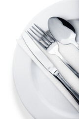 Silverware. Fork, spoon and knife on the plate