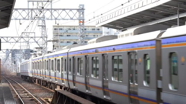 Train Arriving at Station in Japan