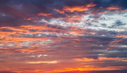 The vast Beautiful sky and four orange clouds that are beautiful sky before sunset. The natural sky before background has a breeze on a bright day in the summer.