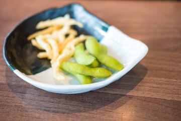 Edamame beans and fried small fish in japan restaurants, appetizers in Japan restaurants