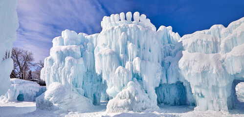 Panoramic winter wonderland covered in snow and giant icicles on a freezing cold day in Minnesota