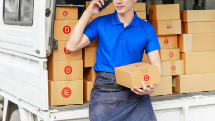 Delivery man asia people checking portable delivery device with parcel box to customer home...
