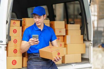 Delivery man asia people checking portable delivery device with parcel box to customer home...