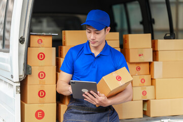 Delivery man asia people checking portable delivery device with parcel box to customer home...