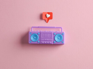 Miniature boombox tape recorder with Social media like on pink background. Creative minimal layout