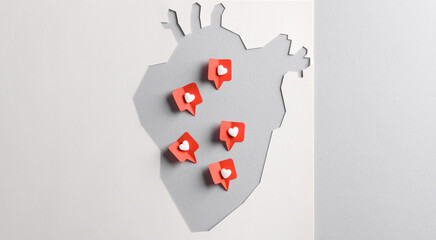 Paper cut Anatomical heart with Social media likes on gray background. Creative minimal layout