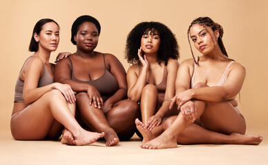 Body, diversity and portrait of natural women group together for inclusion, beauty and power. Aesthetic model people or friends on beige background with skin glow, pride and motivation for self love