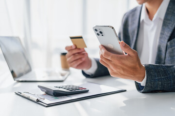 Portrait of bookkeepers asia business man working on tax consultant law in a modern office. Make an...