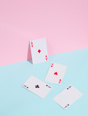 Four aces on blue pink pastel background. Creative layout