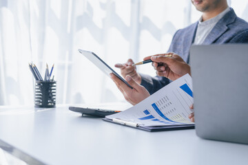 Using tablet pc, Consultant between bookkeepers and accounting lawyer consultation about asset, balance sheet, stock market statistics and yearly tax law, protect business from bribery.