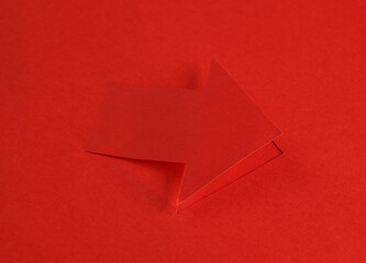 Paper cut red arrow close up