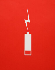 Paper cut low battery on red background - obrazy, fototapety, plakaty