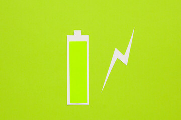 Paper cut full battery level on green background