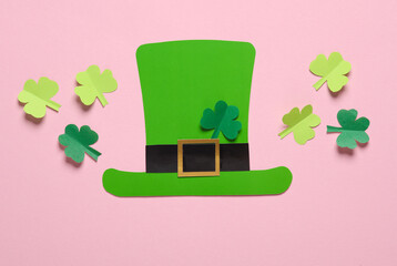 St.Patrick 's Day. Paper leprechaun hat with clover leaves on pink background. March 17. Hand made,...