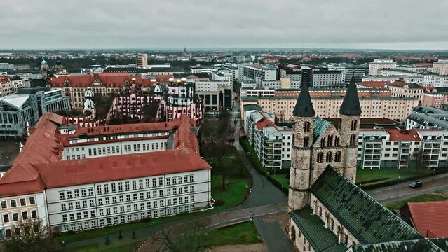 Drone shot revealing Kloster church (Klosterkirche) near Kunstmuseum Magdeburg - Kloster Unser Lieben Frauen (Kunstmuseum Magdeburg - Monastery Of Our Lady) , Magdeburg, Germany