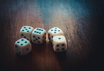 Plastic dice on a wooden table. Board game