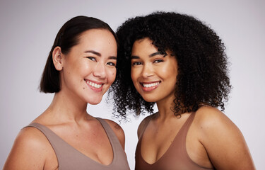Women, face and diversity with portrait, smile with skincare for different skin color with beauty isolated on studio background. Natural cosmetics, glow and dermatology, inclusion and facial care
