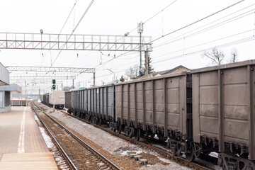Fototapeta na wymiar freight train stands at the railway station. cargo transportation by rail. 