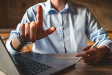Businessman touching the screen with a stylus in hand. For business illustration floating screen...