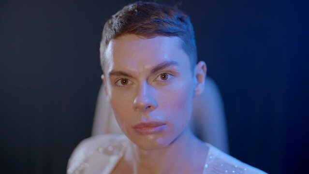 portrait of handsome gay, homosexual fashion model man looking at camera