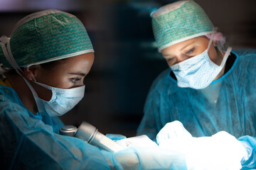 Neurosurgical residents positioning a patient
