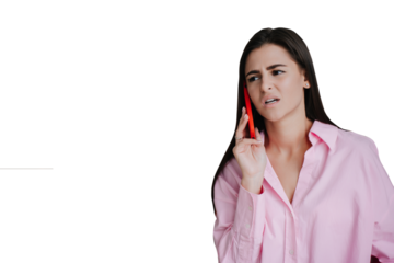 Frustrated young brunette talking by phone with upset expression dressed in pink shirt against ftransparent background. Young woman received bad news, painful expression on face. I can’t hear you
