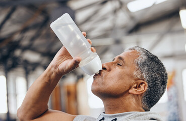 Man, fitness and drinking water bottle for hydration after workout, exercise or cardio training...