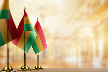 Small flags of the Bolivia on an abstract blurry background