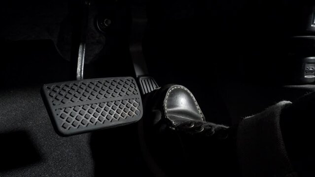 Accelerate and Brake. Foot pressing foot pedal of a car to drive ahead. Accelerator and brake pedal in a car. Driver driving the car by pushing accelerator pedals of the car. inside vehicle automobile