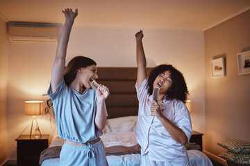 Friends, singing with brush and women in pajamas to get ready for girls night out dancing, fun...