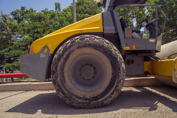 Fototapeta premium Land scraper and Vibro roller the heavy equipment for pretreatment road construction. photo is suitable to use for industry background photography, power plant poster and electricity content media.