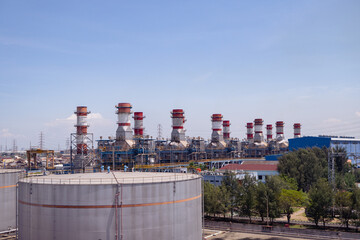 Obraz premium aerial view of combine cycle project power plant when day time with blue sky and cloudy vibes.