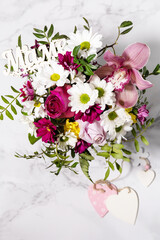 Happy Mothers Day background with dainty flowers. Beautiful greeting card. Holiday concept. View from above. Copy space.