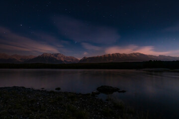 Nighttime starscape of a mountain lake in the Canadian Rocky Mountains, Kananaskis Country Alberta, Canada