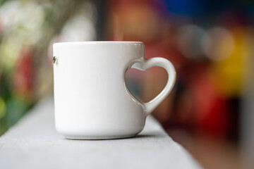 A Close-Up of a White Mug with Love Handle