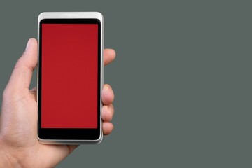 Hands hold a phone with a blank screen