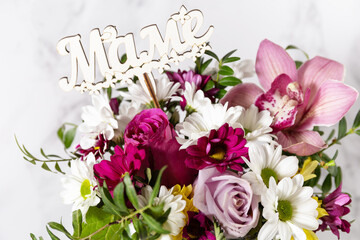 Happy Mothers Day background with dainty flowers. Beautiful greeting card. Holiday concept.