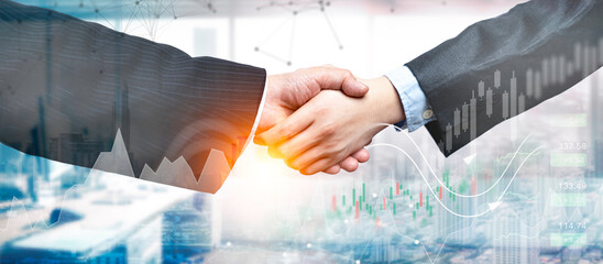 Close up of businessmen shaking hands, Double exposure of forex graph and stock chart hologram with...