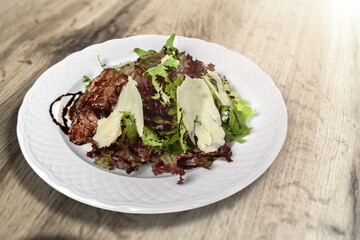 Roasted meat with fresh vegetables and sauce