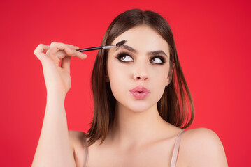 Perfect eyebrows. Natural beauty brows. Eyebrows coloring and lamination. Woman combing eyebrows....