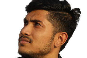 Obraz premium Indian young man looking up, side face view portrait on isolated transparent background.