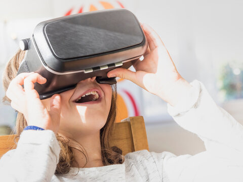 Girl wearing virtual reality glasses