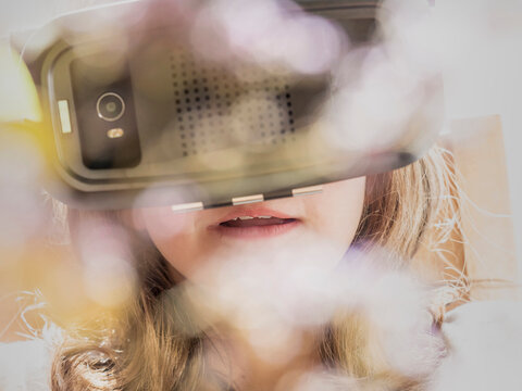 Girl wearing virtual reality glasses