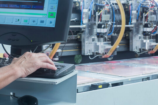 Male engineer working on computer in industry, Hanover, Lower Saxony, Germany
