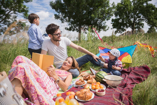 Family enjoying picnic in the countryside, Bavaria, Germany