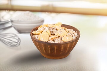 Oat flakes in the bowl. Tasty morning dish