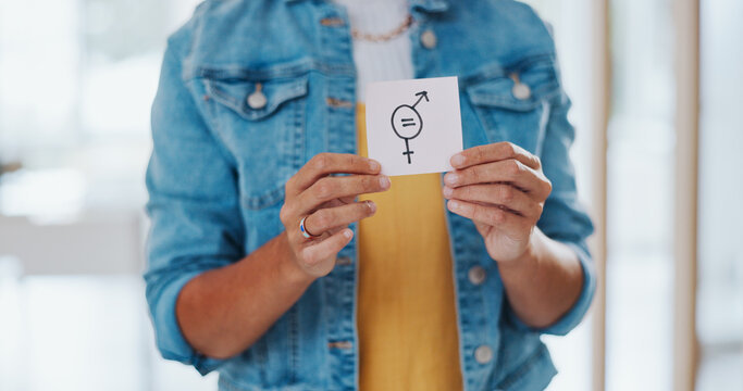 Gender equality, pay gap and woman with a sign in the office with a female and male symbol. Business, equity and girl employee with a feminism card in protest for equal salary, opportunity and equity