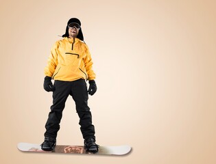 Young happy snowboarder person in jacket posing