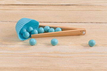 blue balls with a basket on a wooden background.