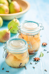 Sweet pickled pears in vinegar with cloves.